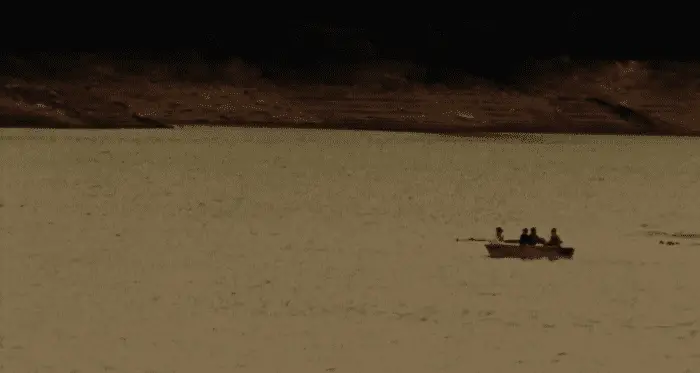 Wide shot of the four participants in the rowing boat
