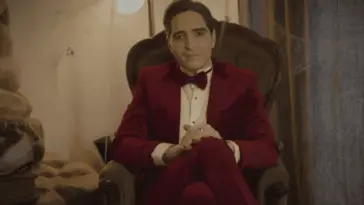 David Dastmalchian sits and prepares for his hosting duties
