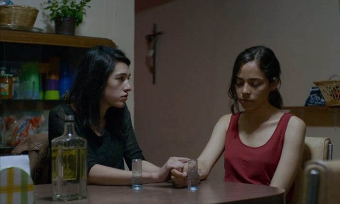 Veronica (Simone Bucio) comforts Alejandra (Ruth Ramos) after the death of her brother. 