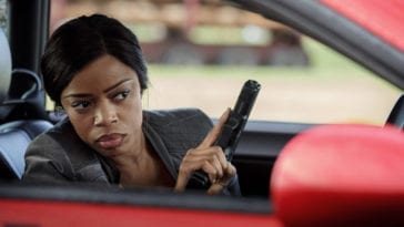 Detective Amanda Fisher holds a gun in Ash vs. Evil Dead