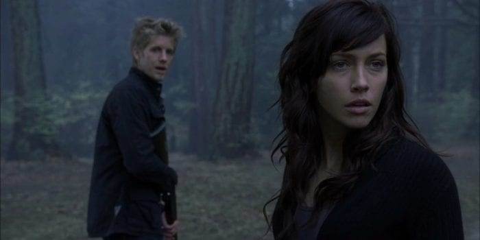 Trish and Shane explore the gloomy forest in Harper's Island.