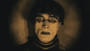 Cesare stares with frightening eyes into the camera