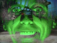 Alice Cooper's face, lit up green, is superimposed over a dungeon, in the TV show, "The Muppet Show."