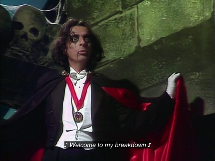 Alice Cooper, dressed as a vampire, sings, "Welcome to my breakdown," in the TV show, "The Muppet Show."