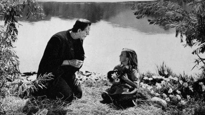 Frankenstein playing with a little girl