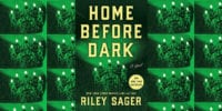 Home before dark book cover with picture of chandelier cast in green light.