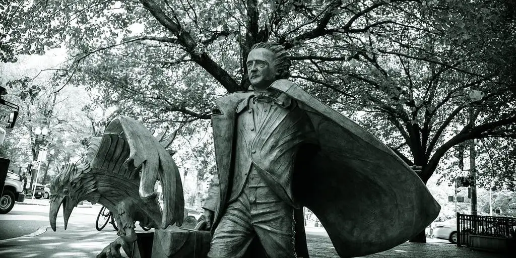 Statue of Edgar Allan Poe with a large raven
