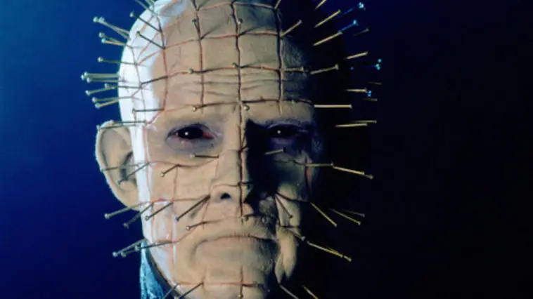 closeup of the iconic Pinhead character's scarred head covered in pins