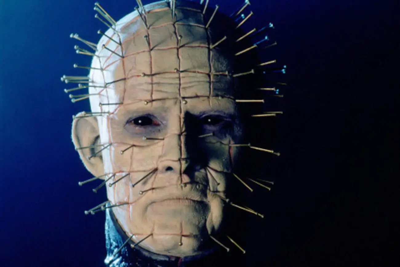 closeup of the iconic Pinhead character's scarred head covered in pins