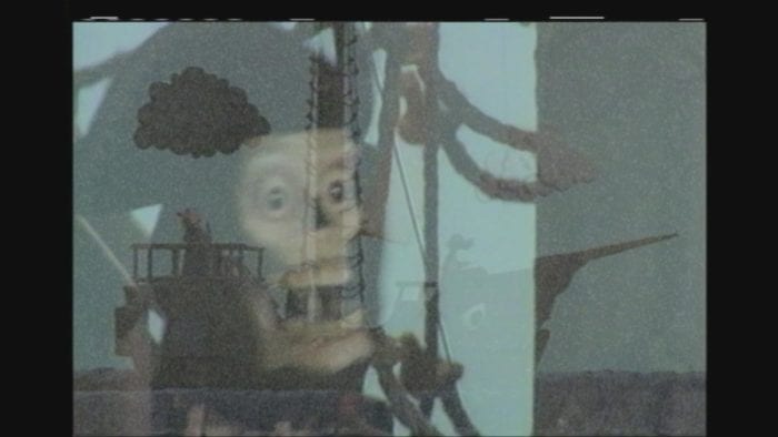 A rare image of Candle Cove actually captured on screen, with an image of Jawbone on top of the ship