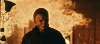 Michael Myers walks out of a fire engulfed house.