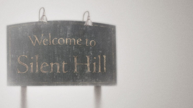 The Silent Hill sign surrounded by fog and mist.