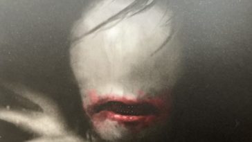 Close up of the ohaguro-betarri on the cover of Nothing But Blackened Teeth