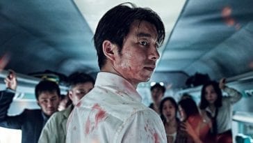 Seok-woo looking back with blood all over him