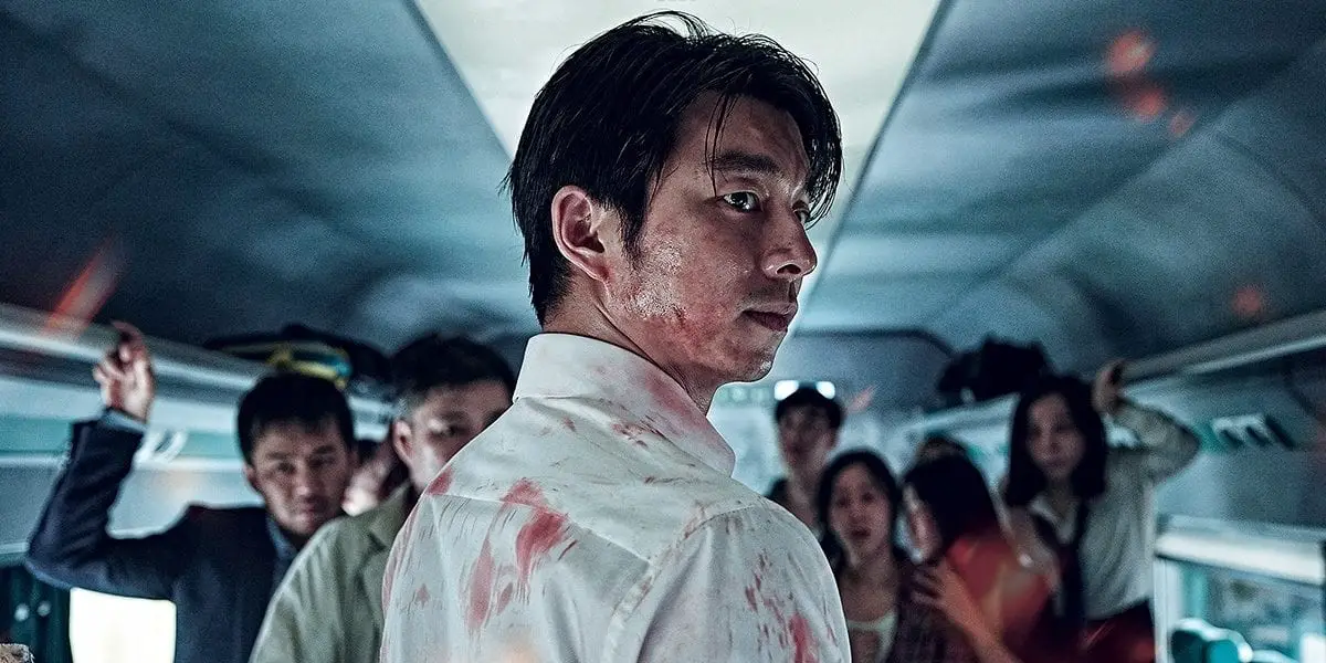 Seok-woo looking back with blood all over him