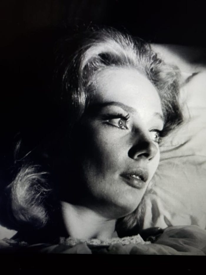 Closeup of Mary Henry played by Candace Hilligoss in chiaroscuro, too anxious to sleep.