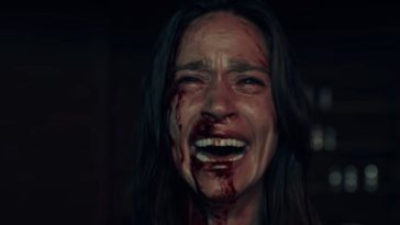Elisa screams as blood protrudes from her nose and right eye