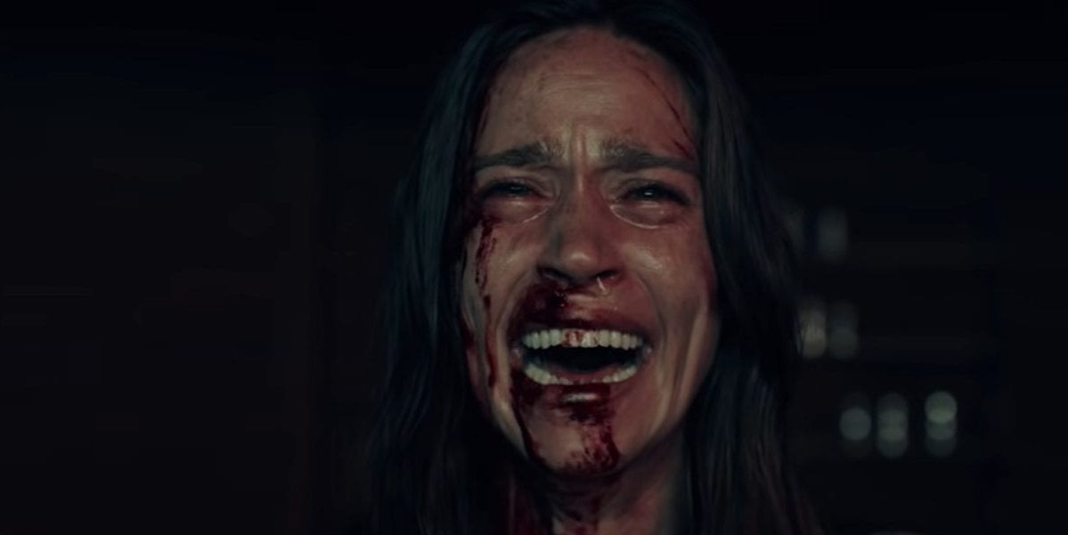 Elisa screams as blood protrudes from her nose and right eye