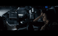 Ripley contemplates her situation in the cockpit