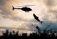 Shark attacking a helicopter in a corn field.