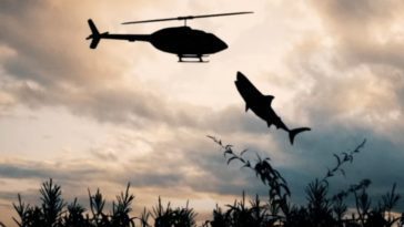 Shark attacking a helicopter in a corn field.
