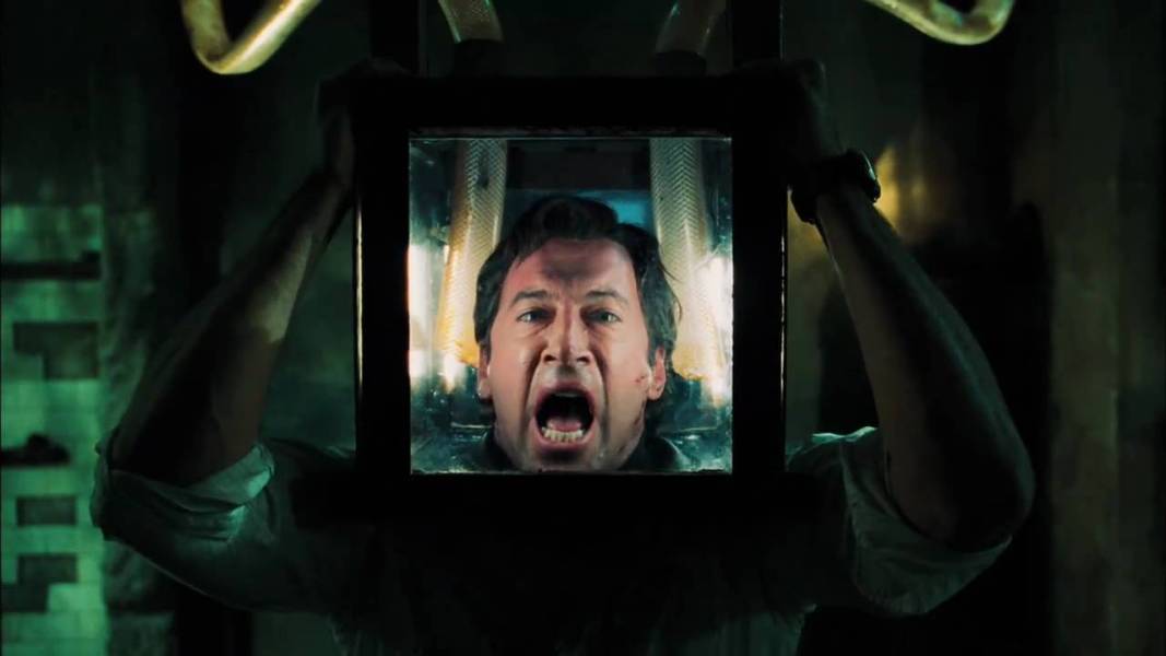 Peter Strahm (Scott Patterson) with his head inside a box in a Saw trap