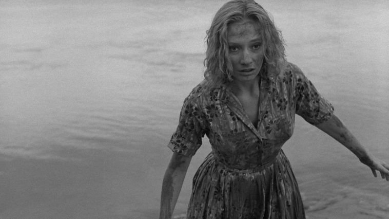 The protagonist of Carnival of Souls stumbles through a street