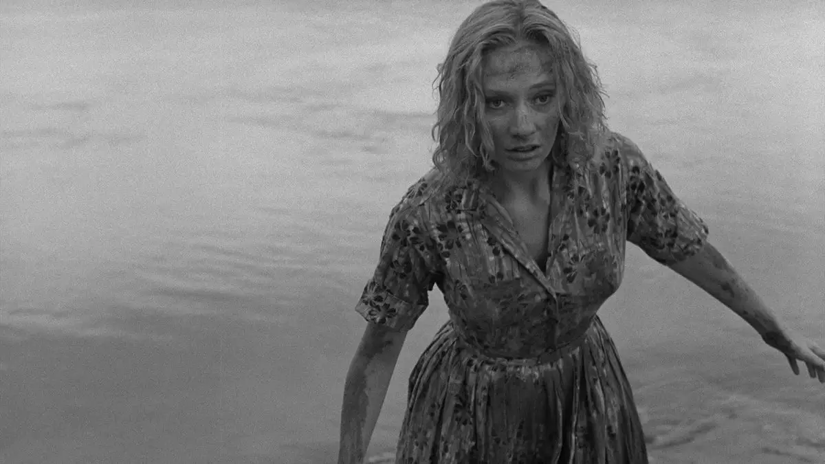 The protagonist of Carnival of Souls stumbles through a street