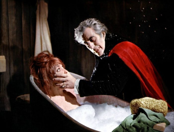 A vampire attacking a woman in a bathtub