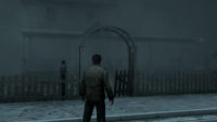 Alex stands outside his home on a fog ridden street