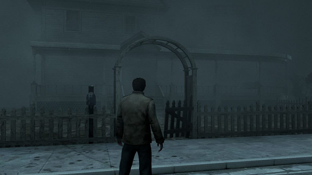 Alex stands outside his home on a fog ridden street