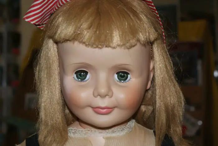 creepy haunted blonde doll