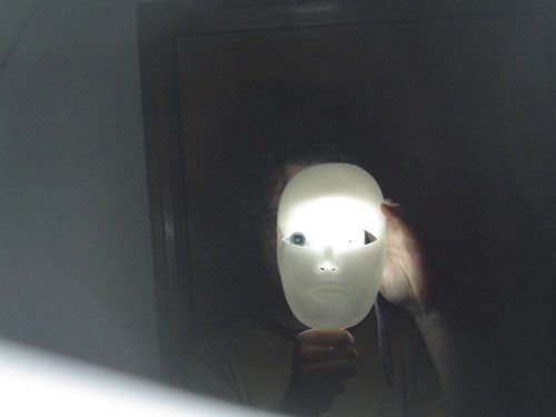 creepy mask in mirror