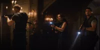 Wesker, Brad, Jill and Chris explore the Spencer mansion with guns drawn