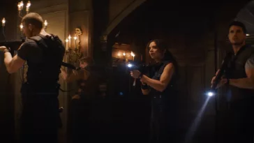 Wesker, Brad, Jill and Chris explore the Spencer mansion with guns drawn