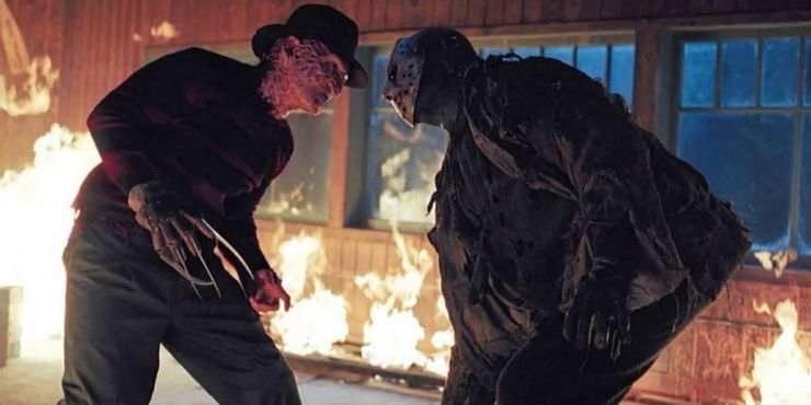 Freddy and Jason have a stare off in a burning cabin