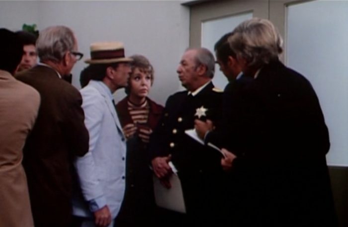 Reporter Kolchak grilling a Chicago police caption at a press conference