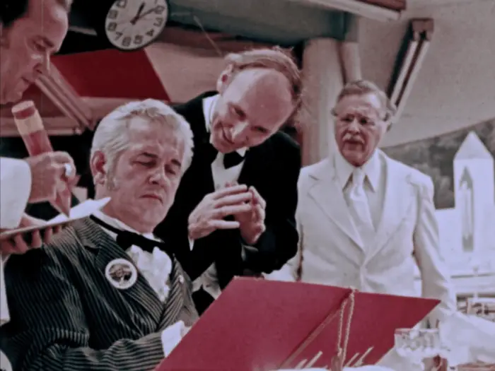 The Old Man (Lincoln Mazall) is ignored while the staff of the restaurant eagerly wait on the rich man