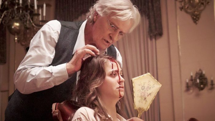 Joseph Peach (Rutger Hauer) performs an operation on Alice to rid her of schizophrenia 