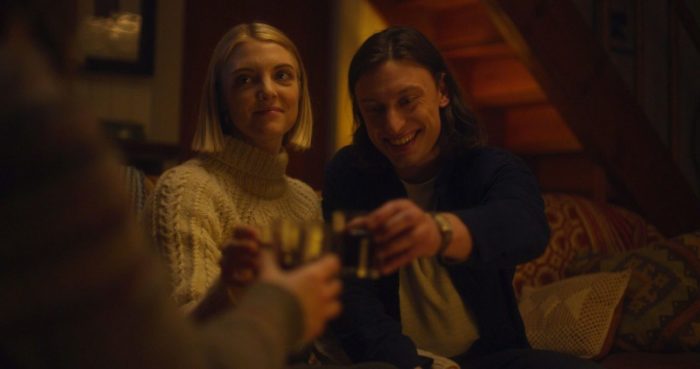 Emily and Brenden share a toast.