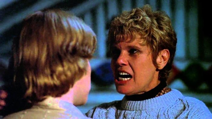 Pamela Voorhees speaks intensely to one of the camp counselors.