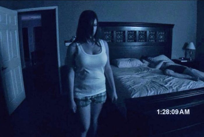 Katie walking creepily by the bed