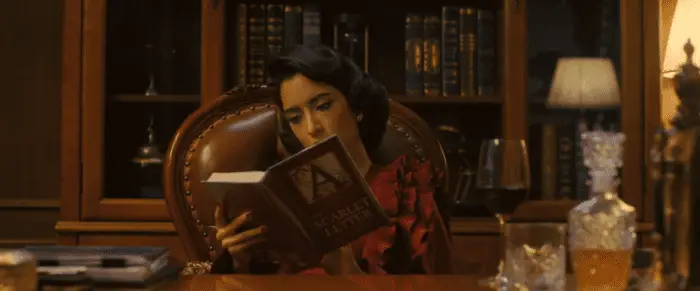 Uma reads the book The Scarlet Letter