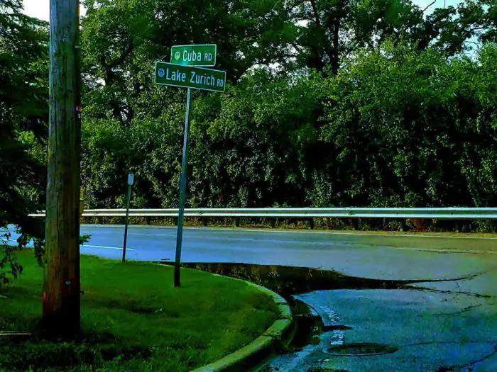 Street sign for Cuba Road on a rain swept street
