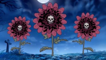 A trio of mums bloom under a graveyard's moonlit sky