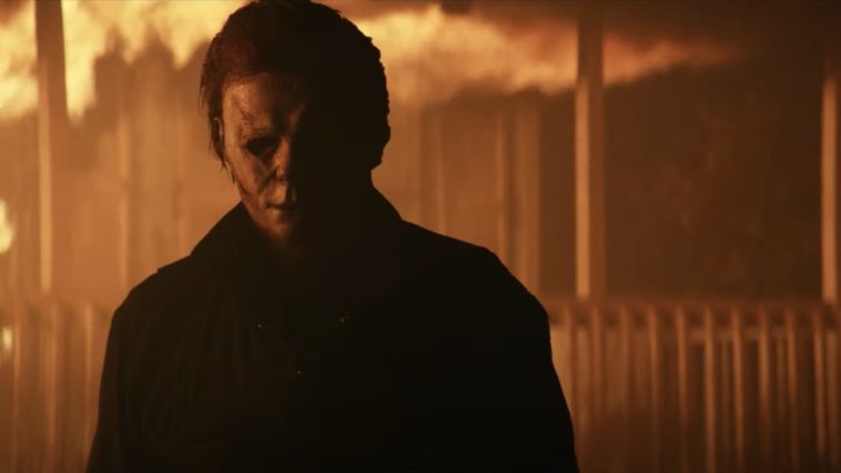 Michael Myers walks away from a burning house