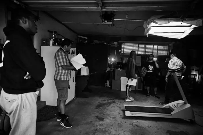Savvas Christou working with cast to get the basement scenes right