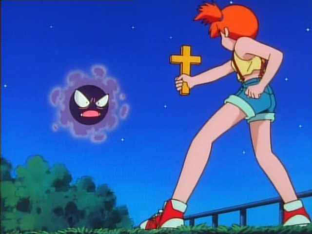 Misty raises a cross at Gastly, the ghost pokemon
