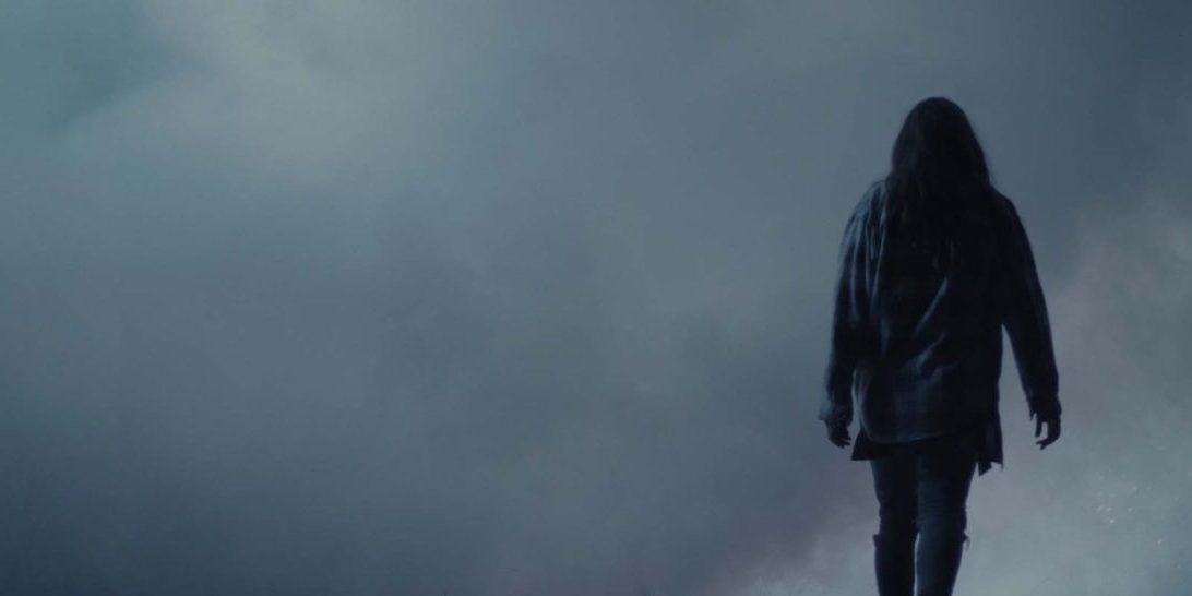 Beth approaches a wall of fog