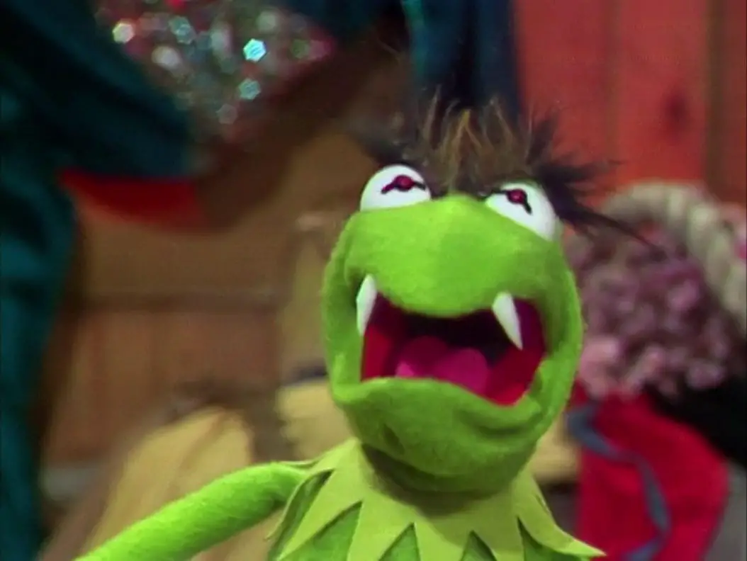 Kermit the Frog gives a menacing face in his "Hyde" form with bushy eyebrows and fangs, from the TV show, "The Muppet Show."
